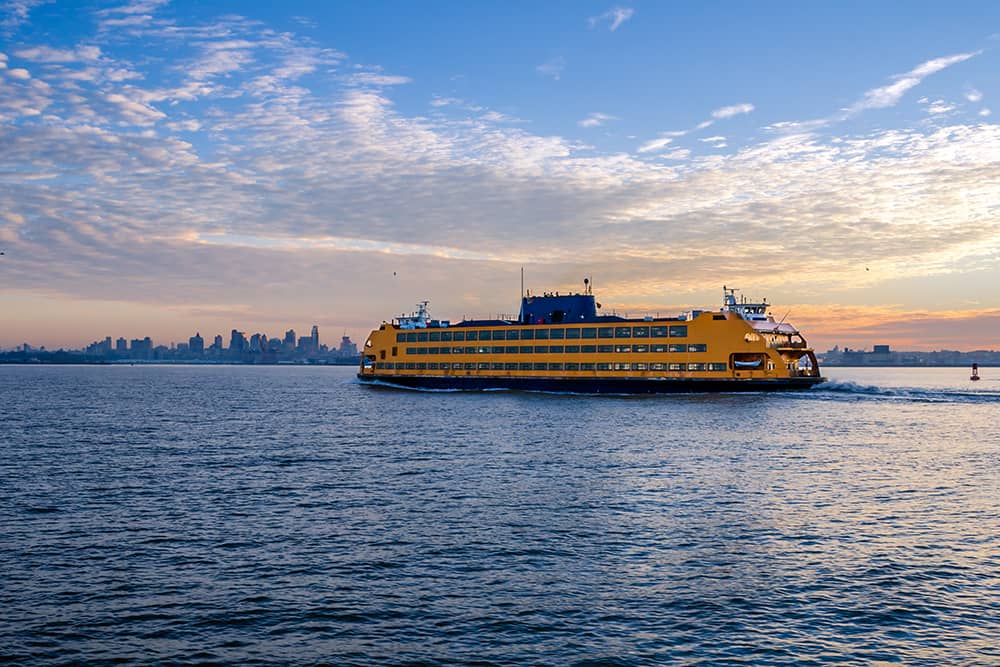 The Staten Island Ferry on the water at sunset, one of the best free activities for families in New York