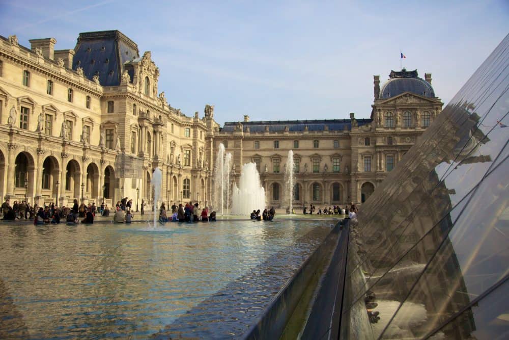 View of the pool and fountains at the Louvre Museum