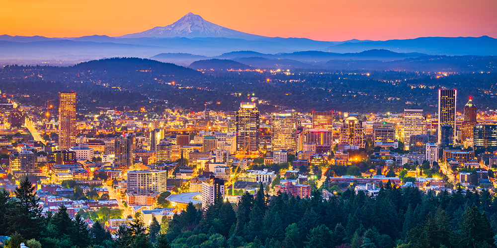 A Portland city skyline with mountain views