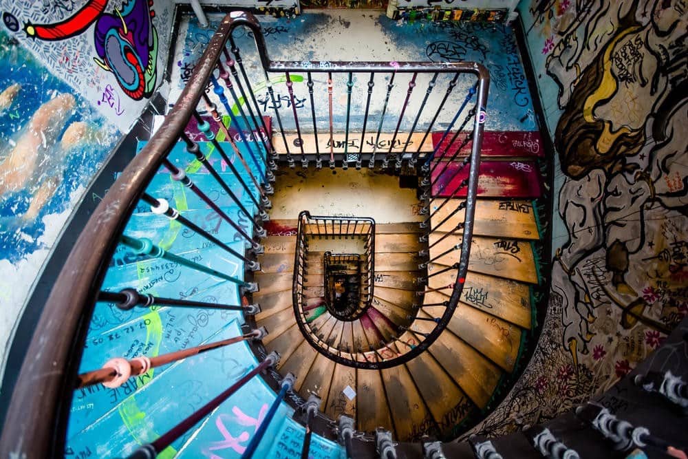 The colorful graffiti-lined staircase at 59 Rivoli art studio and showcase in Paris, France.