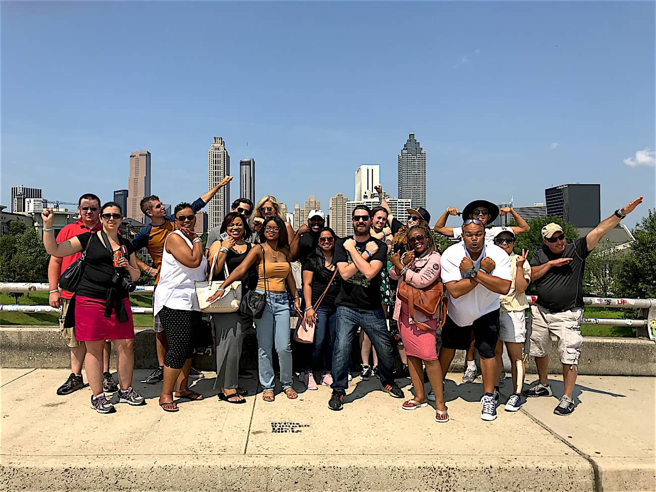 A group of superhero fans stand on Atlanta's bridge.