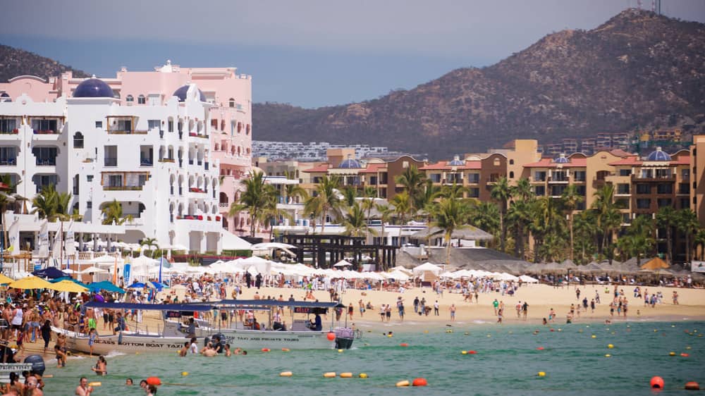 Beach goers on Medano Beach Los Cabos Mexico