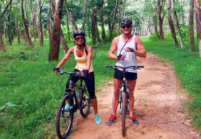 Two people riding bikes in Thailand Jungle