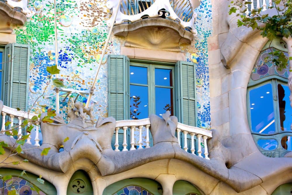 The façade of Casa Batlló decorated with a colorful mosaic