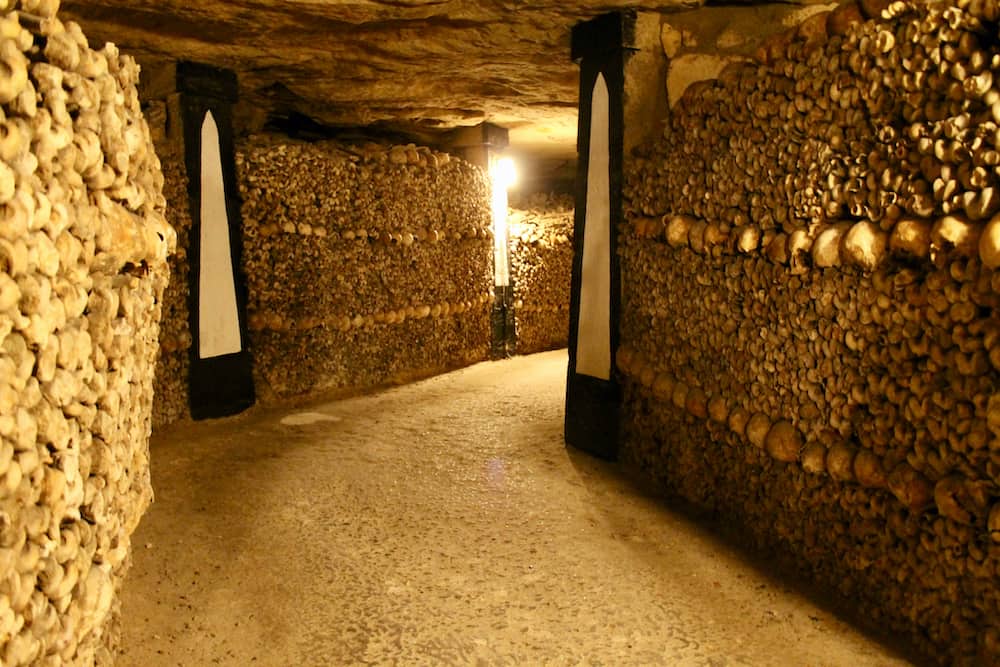 The underground catacombs where galleries and tunnels are lined with thousands of human skulls, containing underground history of Paris, France.