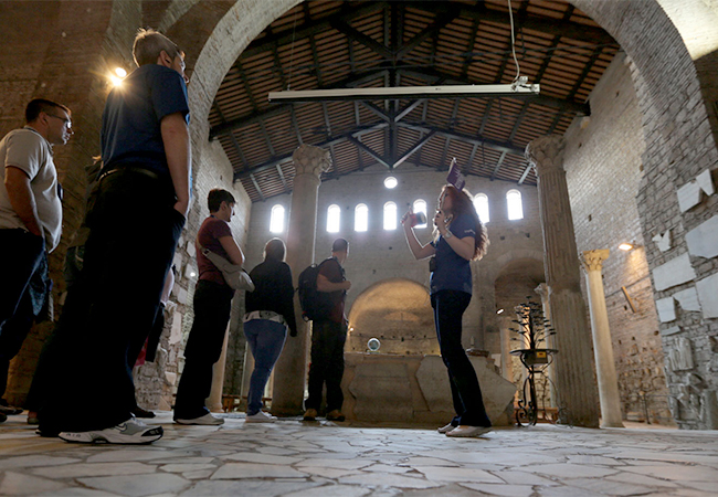 Group on a night tour of the catacombs and mysteries in Rome