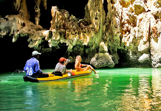 Three people on Kayak tour of Caves on Thailand coast
