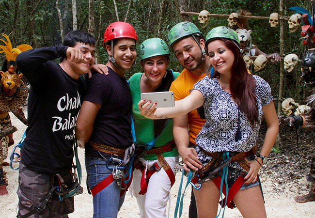 Group of friends pose for photo at Chak Balam Prehispanic Park of Cancun
