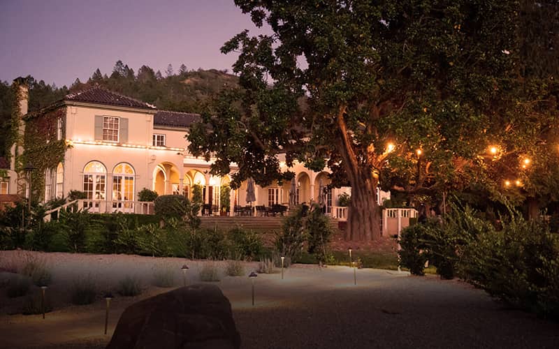 The main property at the Chateau St. Jean at twilight during an evening wine tasting. 