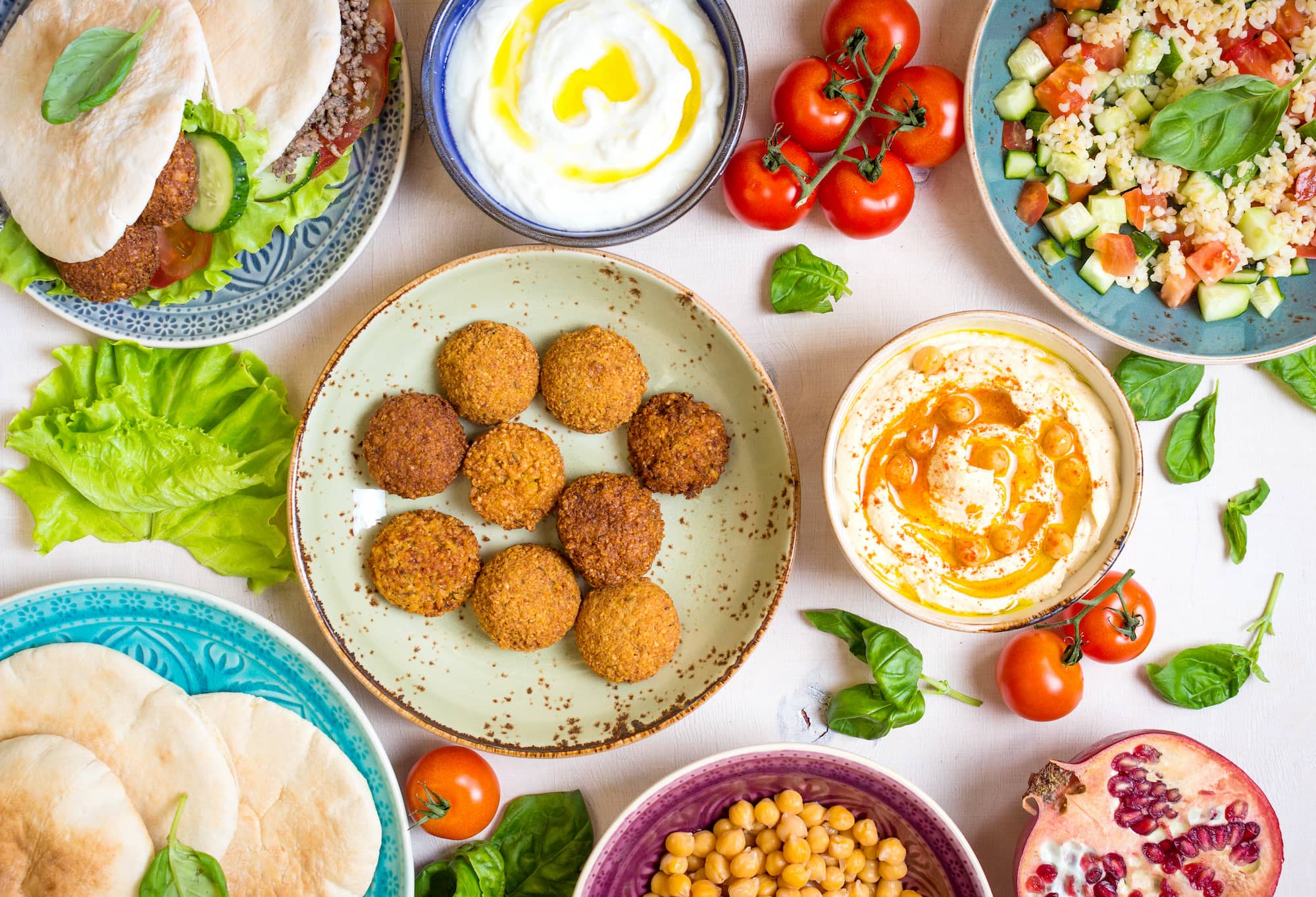 Traditional Middle Eastern and vegetarian food is served on a table and is a good option for tasty cheap eats.