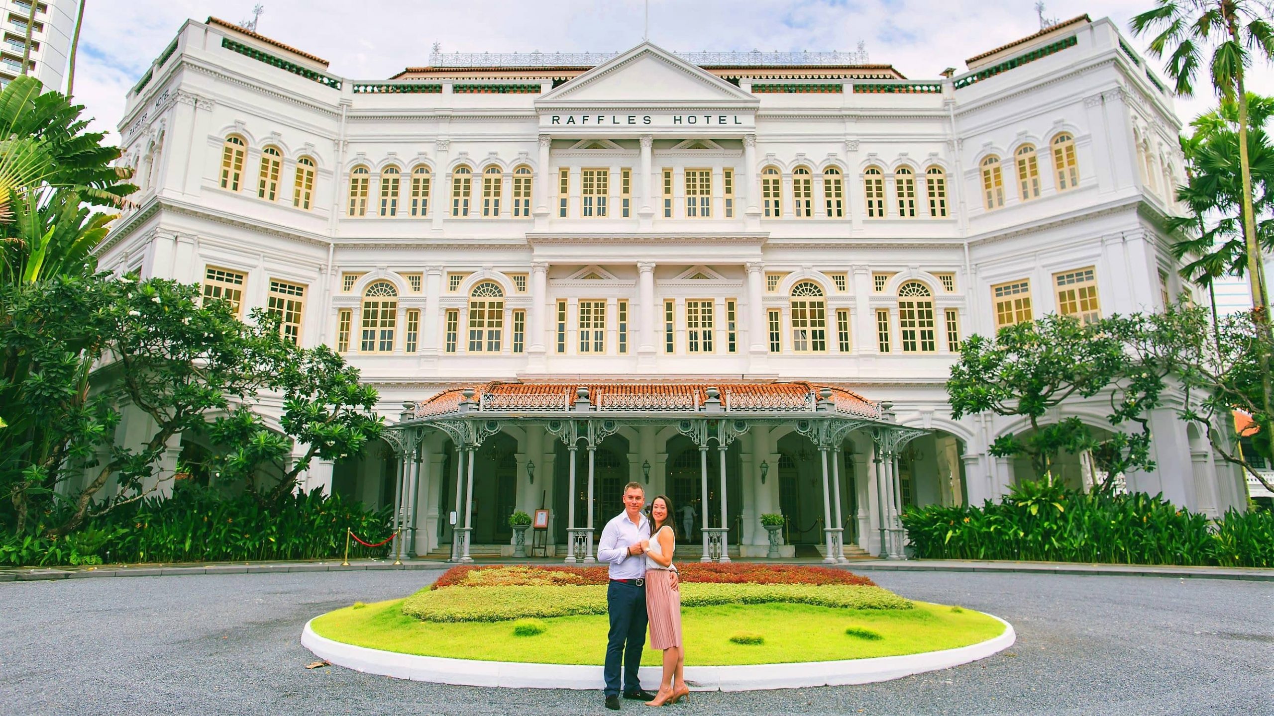 Couple in front of Raffels Hotel