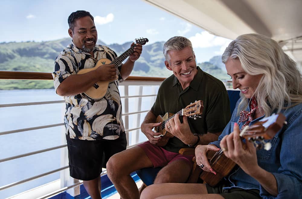 Couple playing ukulele aboard a Princess Hawaii Cruise