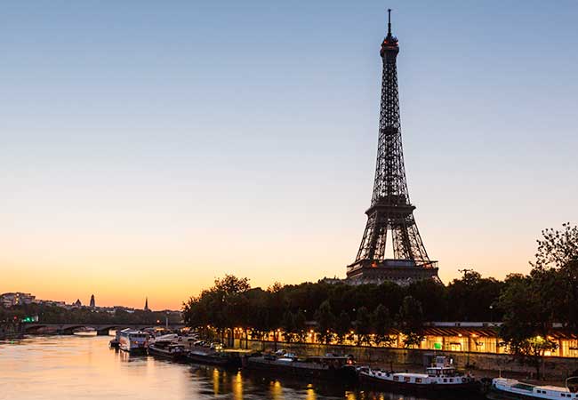 Eiffel Tower and Seine River at sunset in Paris