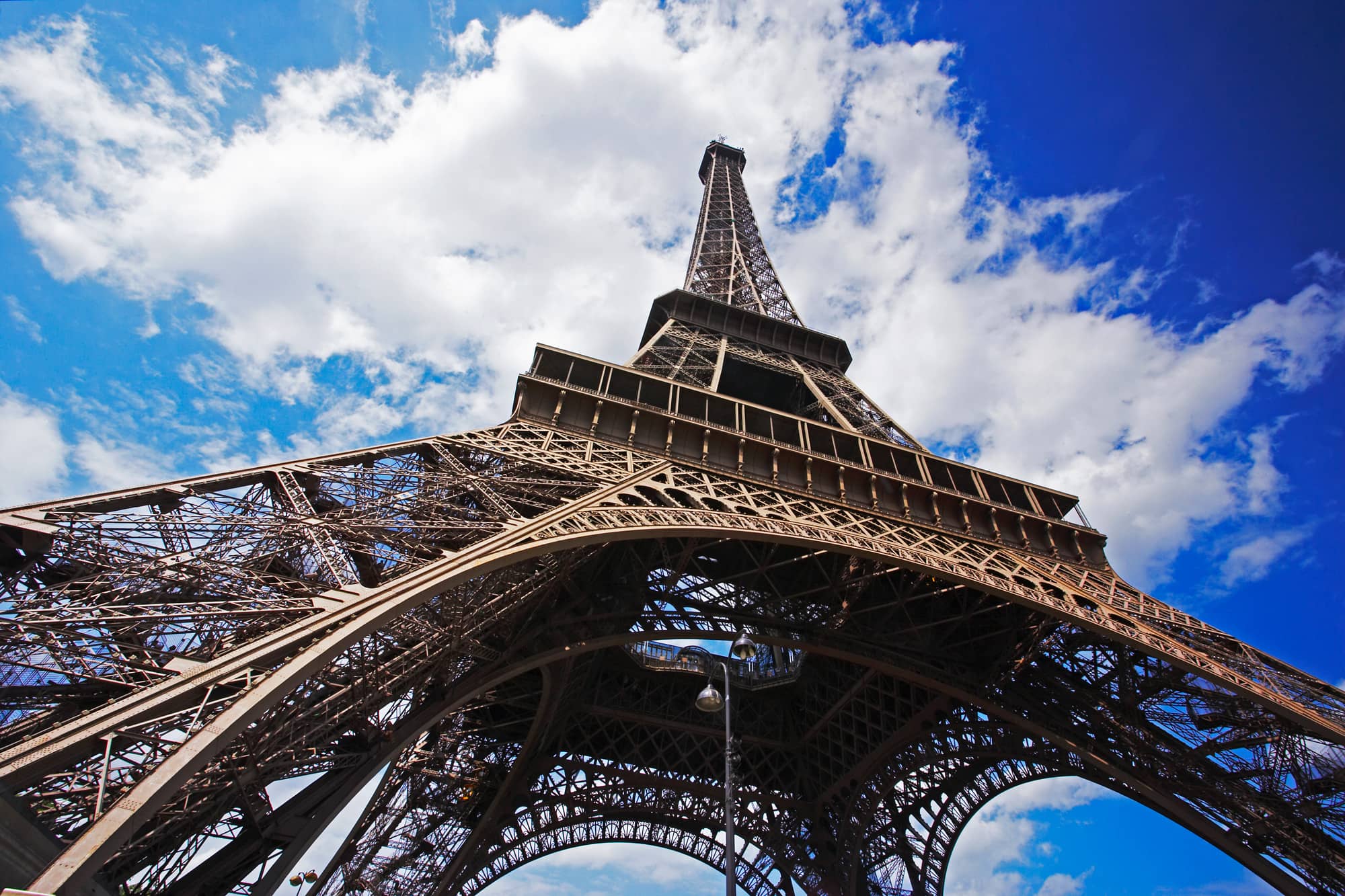 The Eiffel Tower, shrouded in clouds.