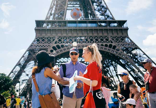 Tourists at the entry of the Eiffel tower in Paris