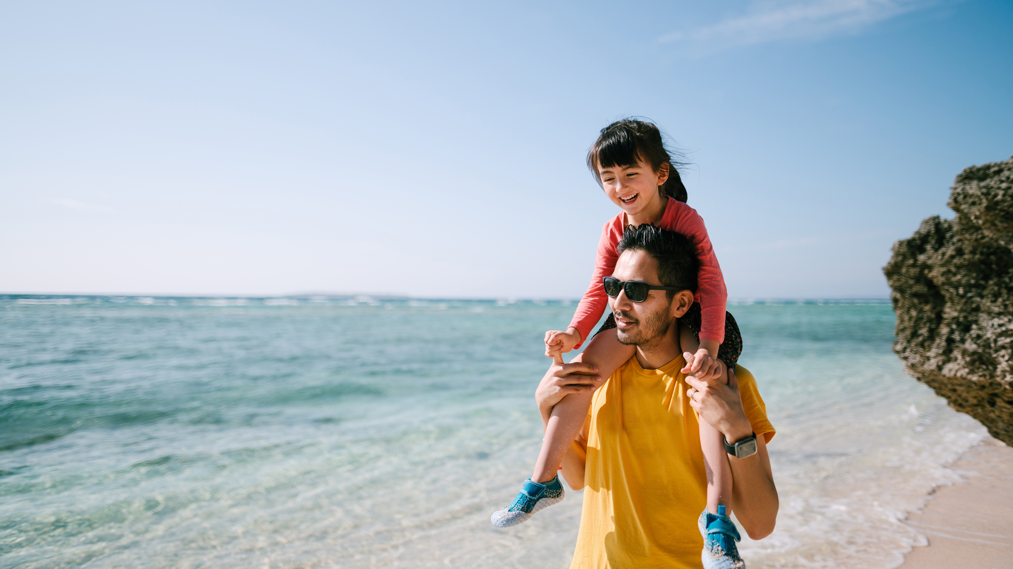 Father and daughter at the beach