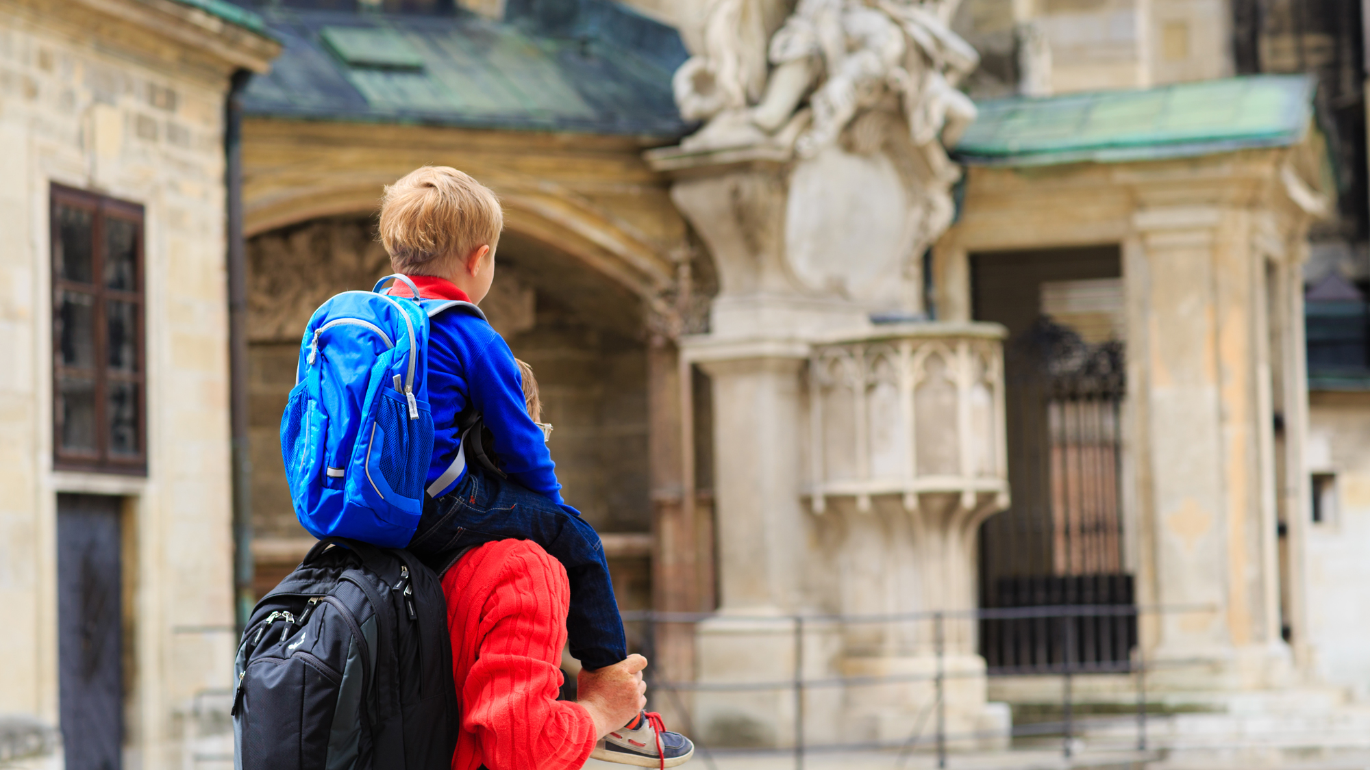 Father with son on his shoulders visiting Europe