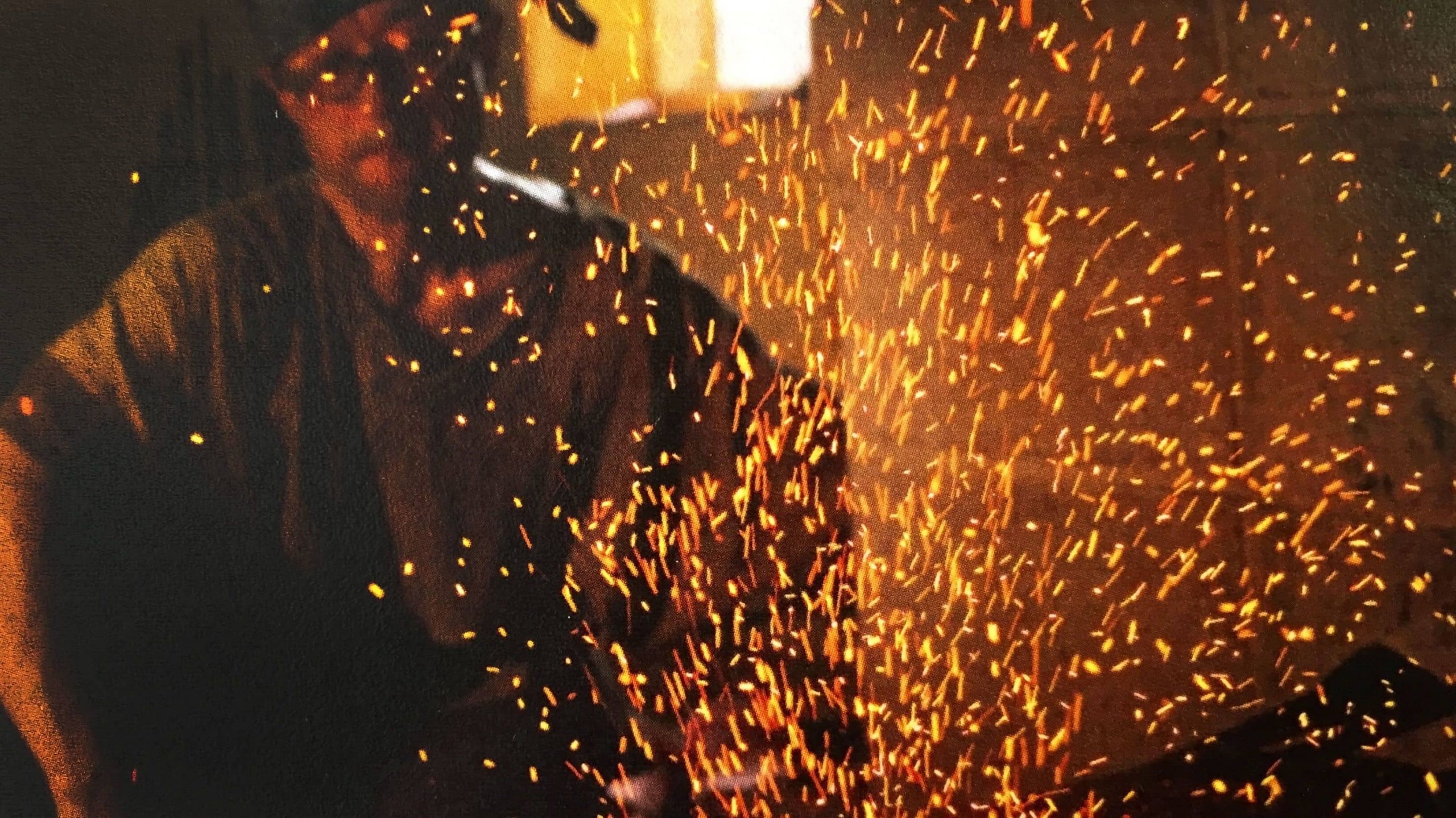 Sparks fly as a man forges a small Japanese katana in Kyoto