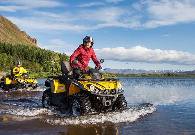 ATV driving through river in Reykjavik