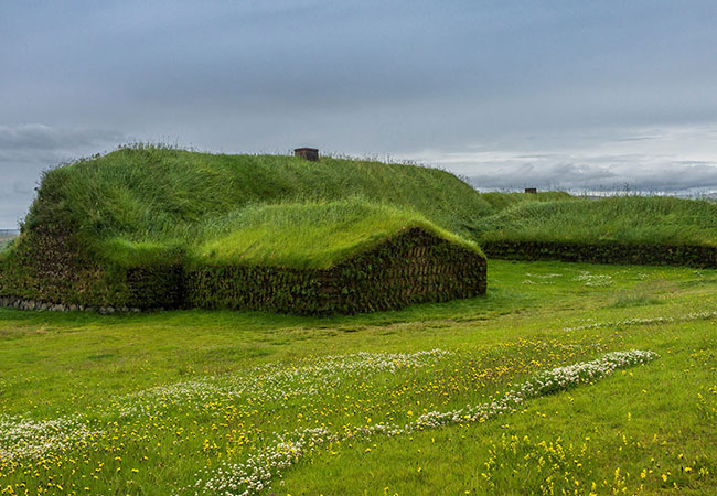 Large grass covered house on hillside in Reykjavik