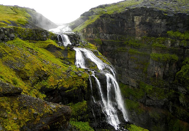 Large waterfall cascading down cliffs in Reykjavik