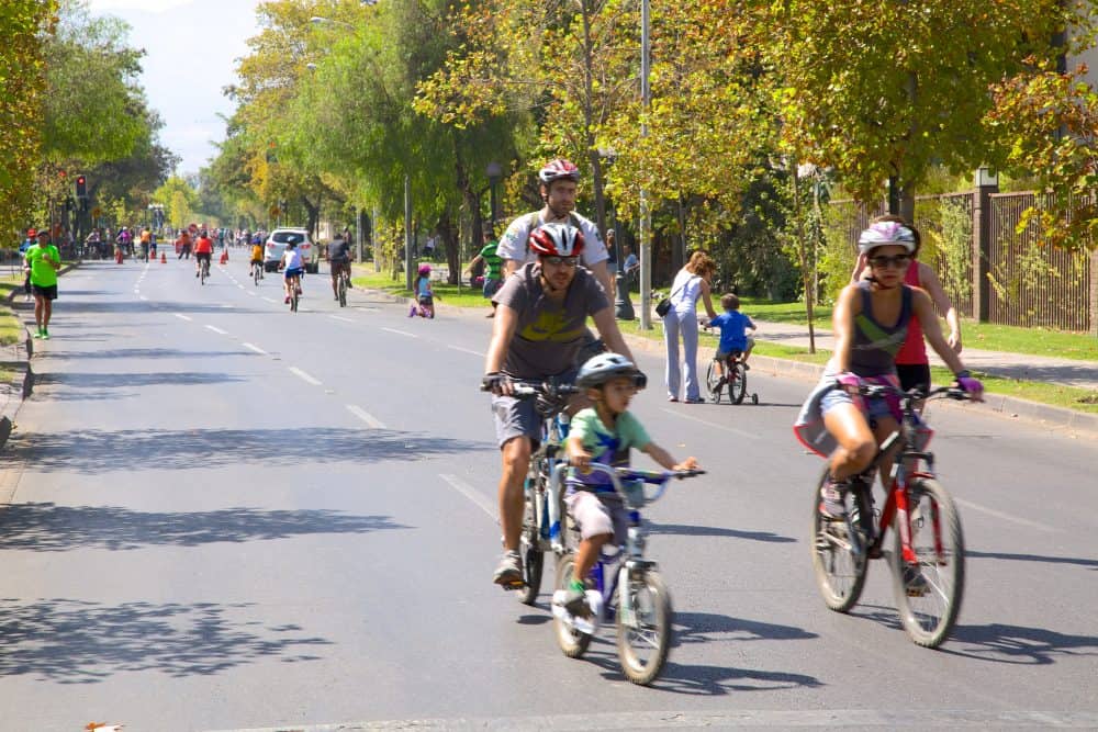 People biking on a street in Santiago