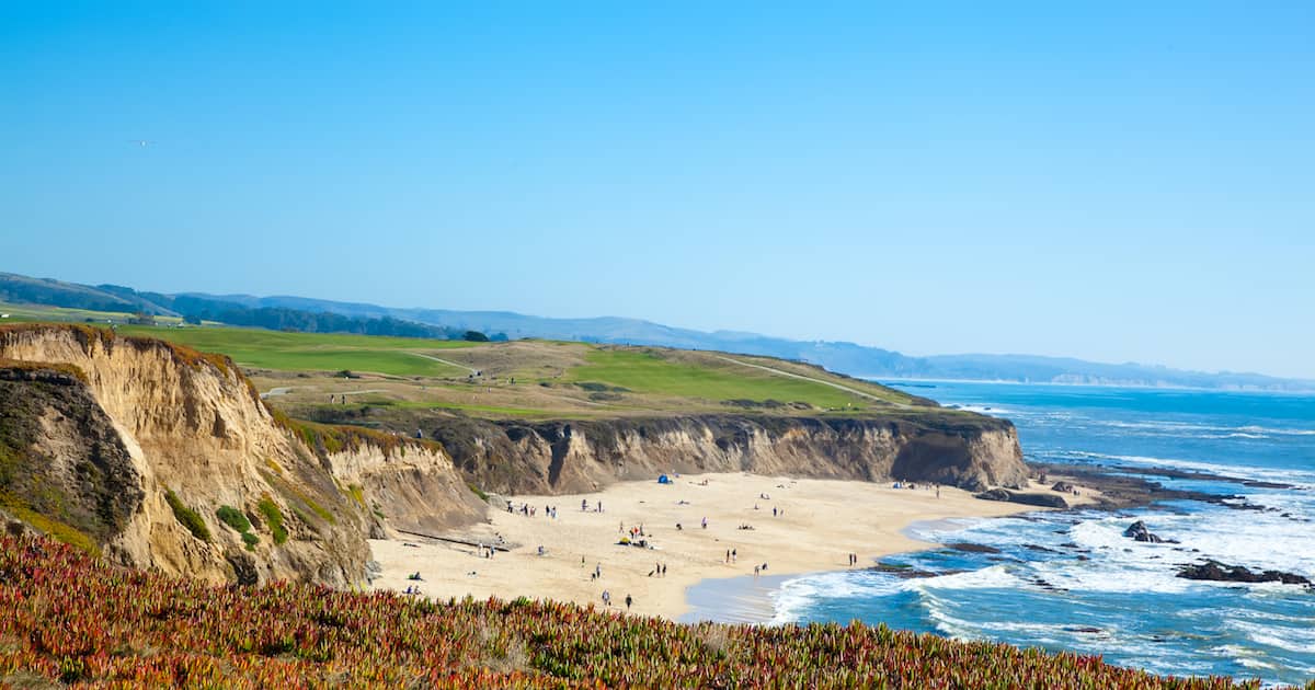 Beach and seaside cliffs at Half Moon Bay California while driving from San Francisco to Los Angeles on a road trip.