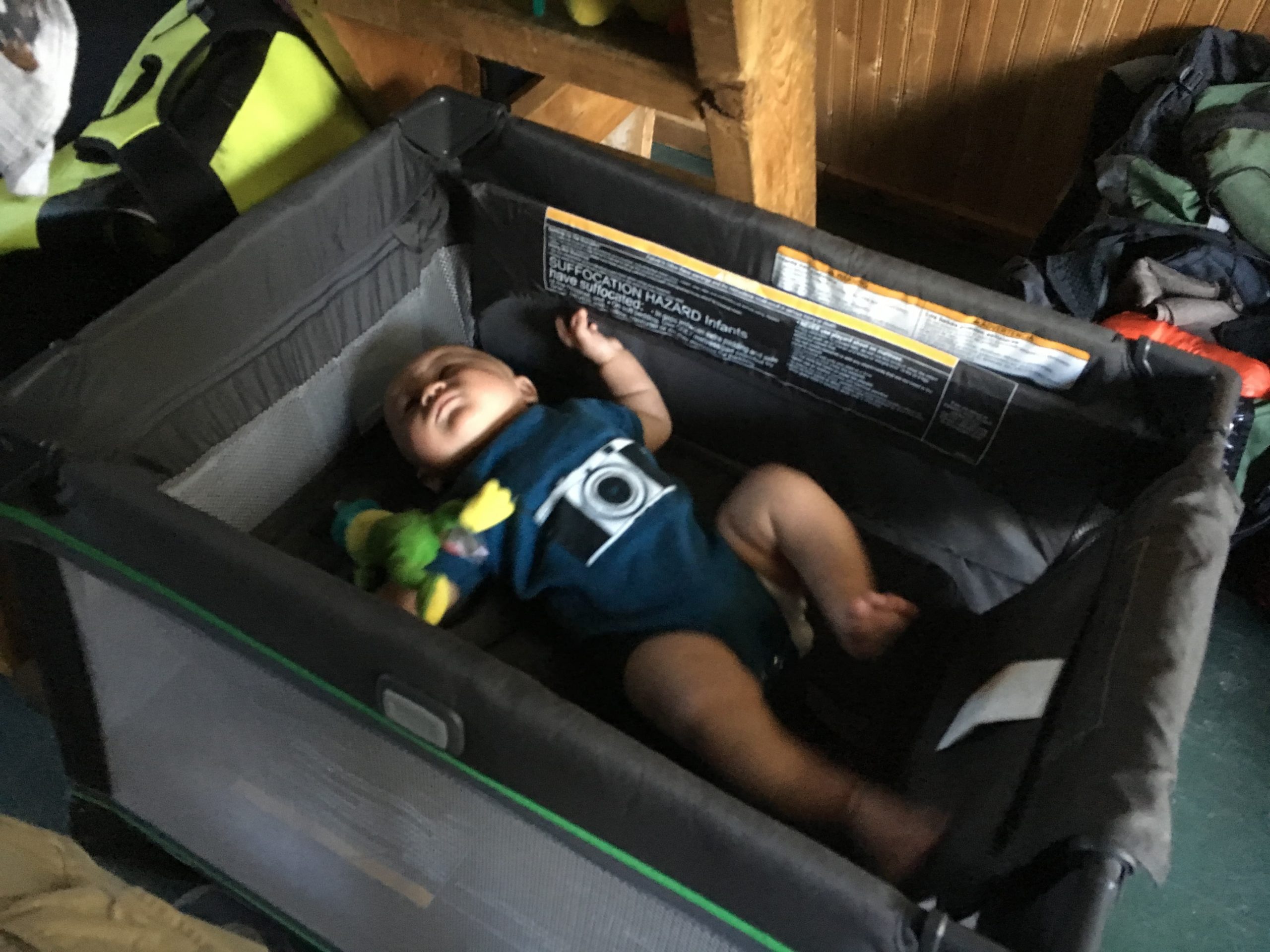 Our little guy exploring the confines of his Pack 'n Play while camping