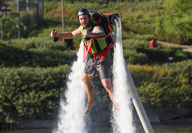 Man with a jet pack over a lake in Las Vegas