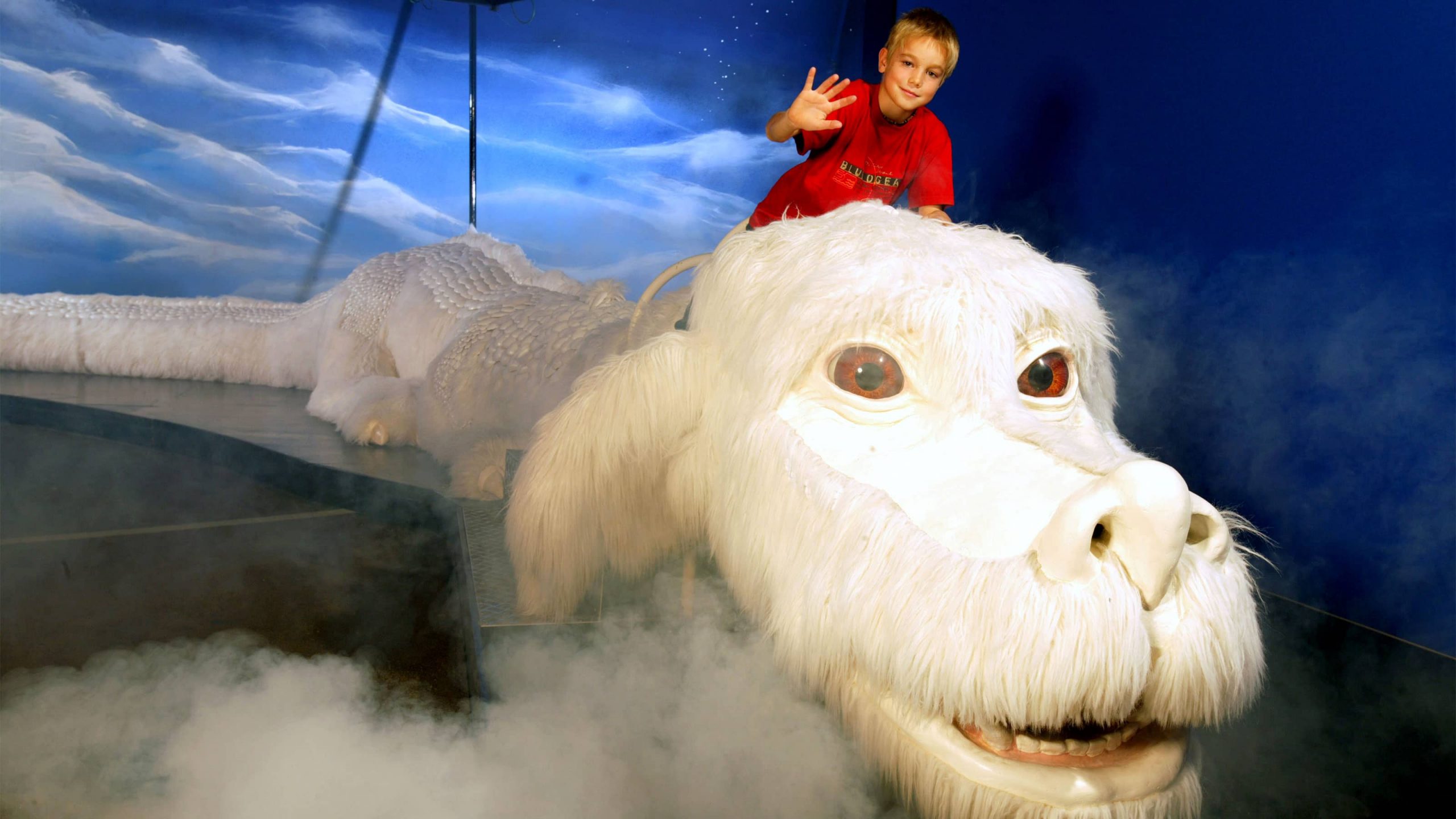 Kid Riding Falkor the Luckdragon