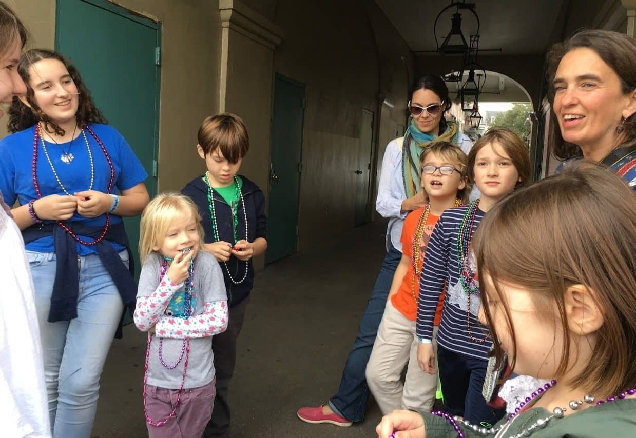 Kids laughing and smiling while on a French Quarter on Family friendly walking tour in New Orleans