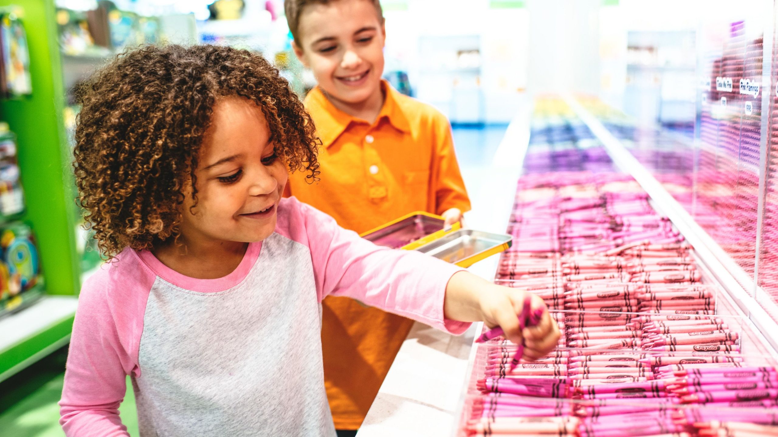 Kids playing with crayons at the Crayola Experience in Orlando