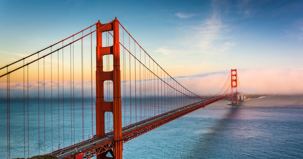 Sunset view of the Golden Gate Bridge and fog from Battery Spencer, Golden Gate National Recreation Area, in San Francisco, California, when leaving the city to go on a SF to LA road trip.