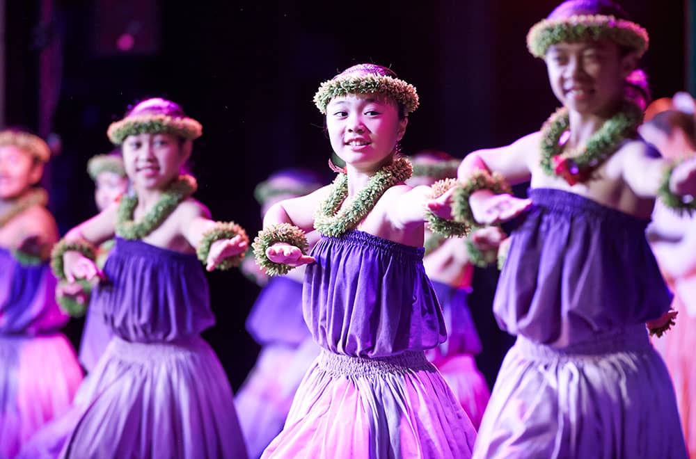 Little girls performing a Luau dance in a Princess Hawaii Cruise