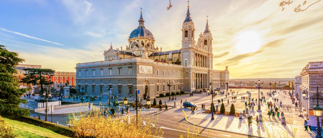 Sunny view of Almudena Cathedral and Plaza De La Armeria in Madrid