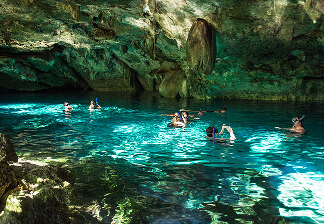 Group snorkeling in cenote in Cancun