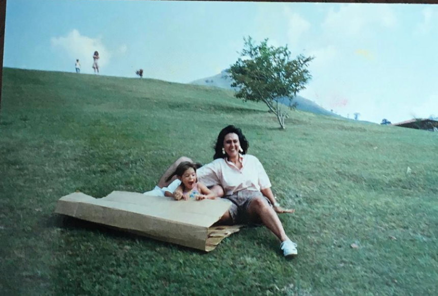Daughter and her mom rolling down the hill in Titiribi