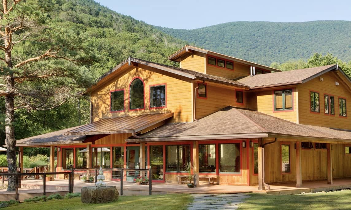 This is a beautiful brown wooden spa building for Menla, Phoenicia Yoga Retreat in New York.