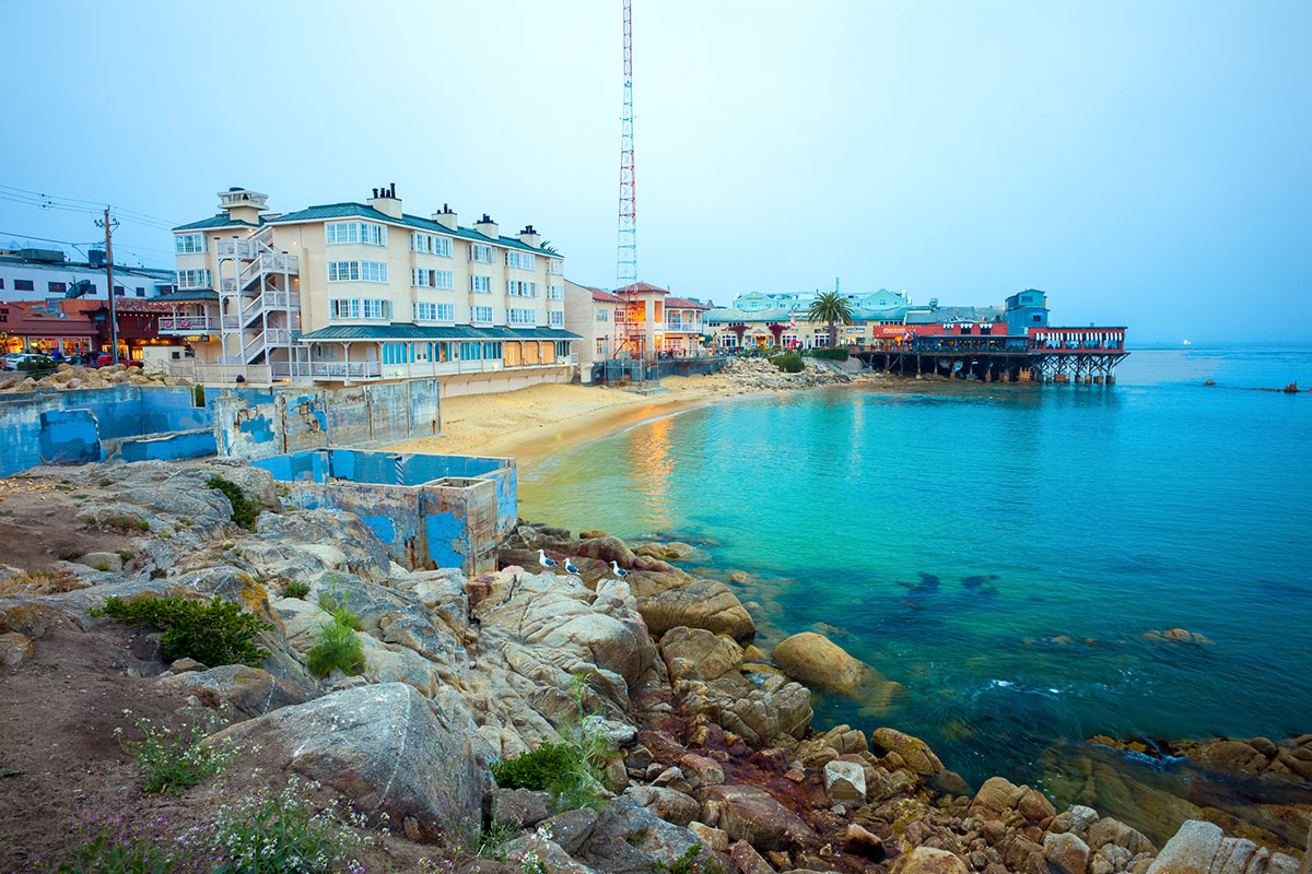 Luxury vacation rentals and local shops along the waterfront in Monterey, California