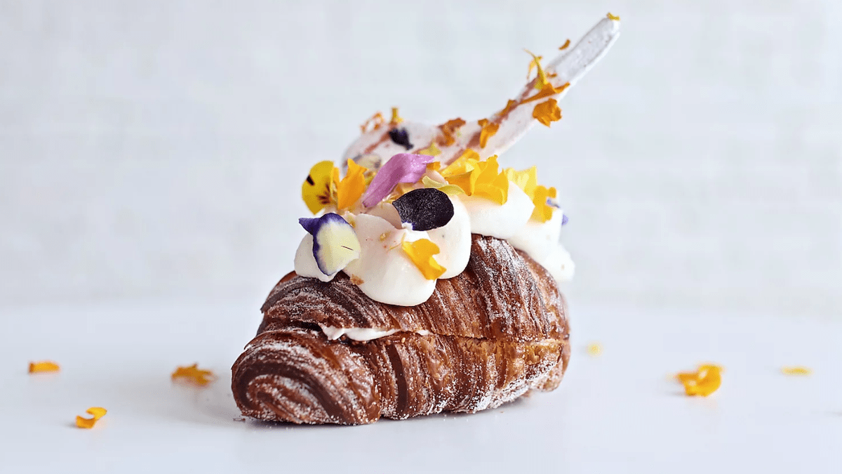  A sugared croissant decorated with icing and hawaiian flowers from the cheap but delicious, Mr. Holmes Bakehouse in LA, California.