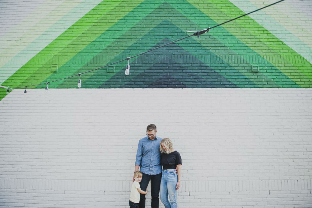 family in Nashville against a colorful wall 