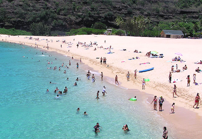 People on beach in North Shore in Honolulu