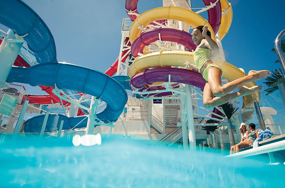 Kid jumping in the pool and having fun Amazing aqua park at Norwegian Encore