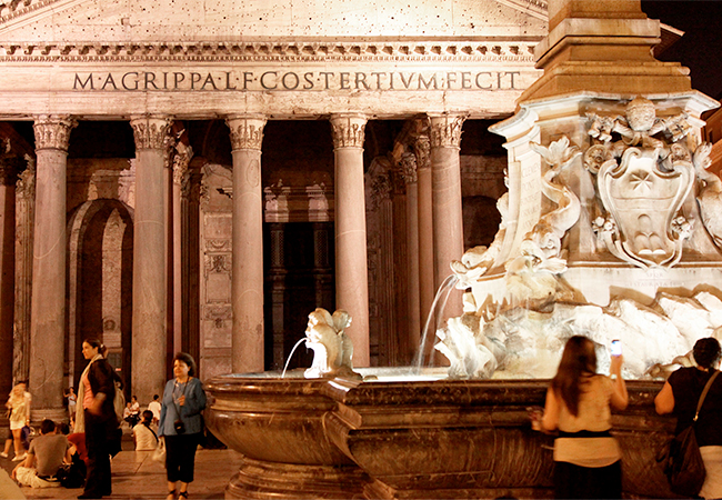 Night view tourists visiting the Pantheon in Rome Italy