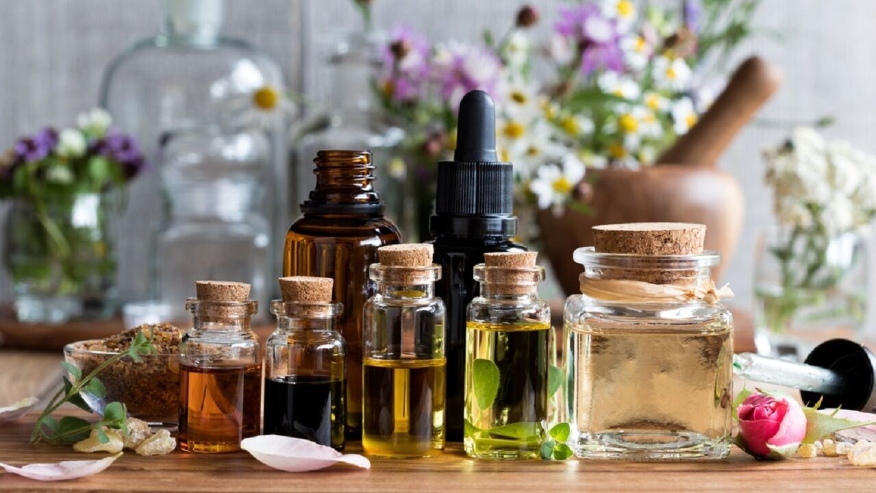 Bottles filled with colorful liquids for an online perfume making workshop