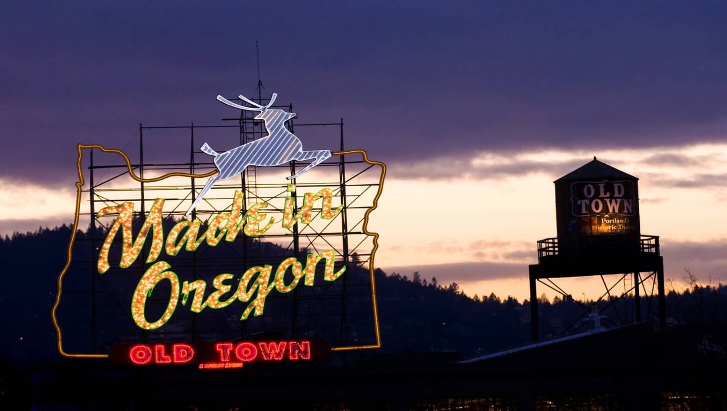 A sign reading Made in Oregeon with the state logo lighting up the street nearby to the Portland Wine Bar in Oregon. 