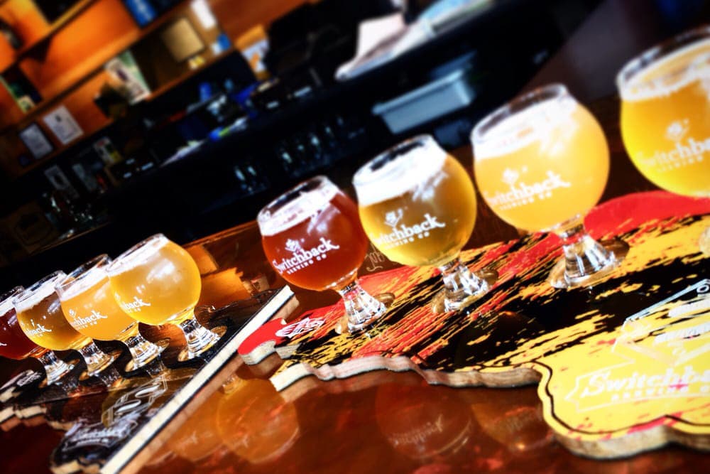 A tasting flight of craft beers lined up at Switchback Brewing Company in the staycation city Burlington