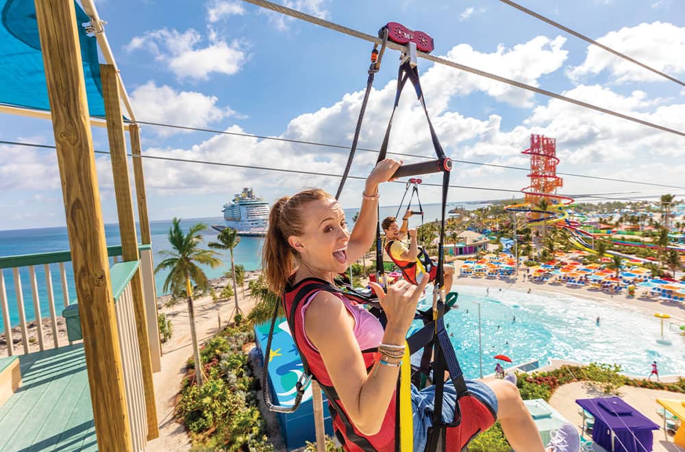Couple having fun while doing zipline in a Royal Caribbean Cruise Endless cruise activities for couples at Royal Caribbean