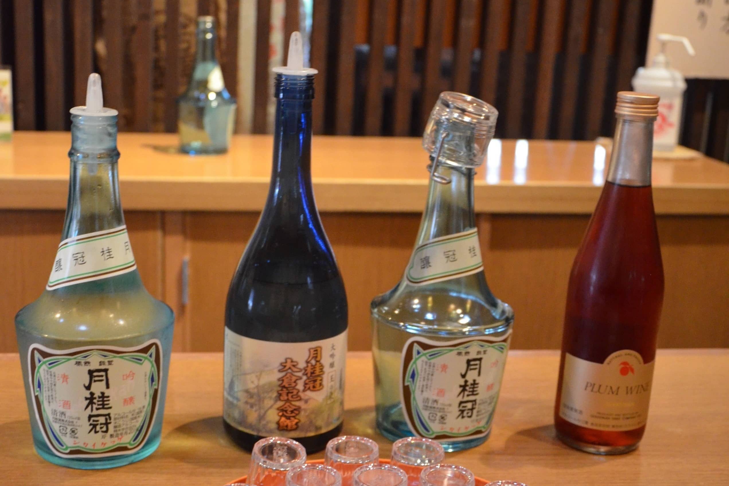 Sake bottles lined up and ready for sampling