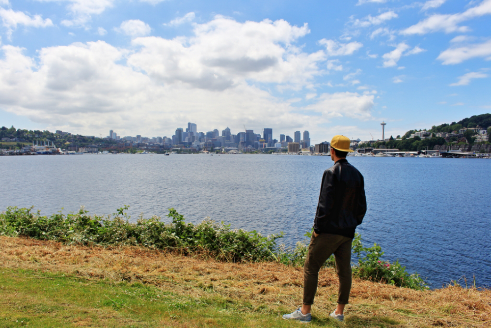 stylish man overlooks Seattle skyline